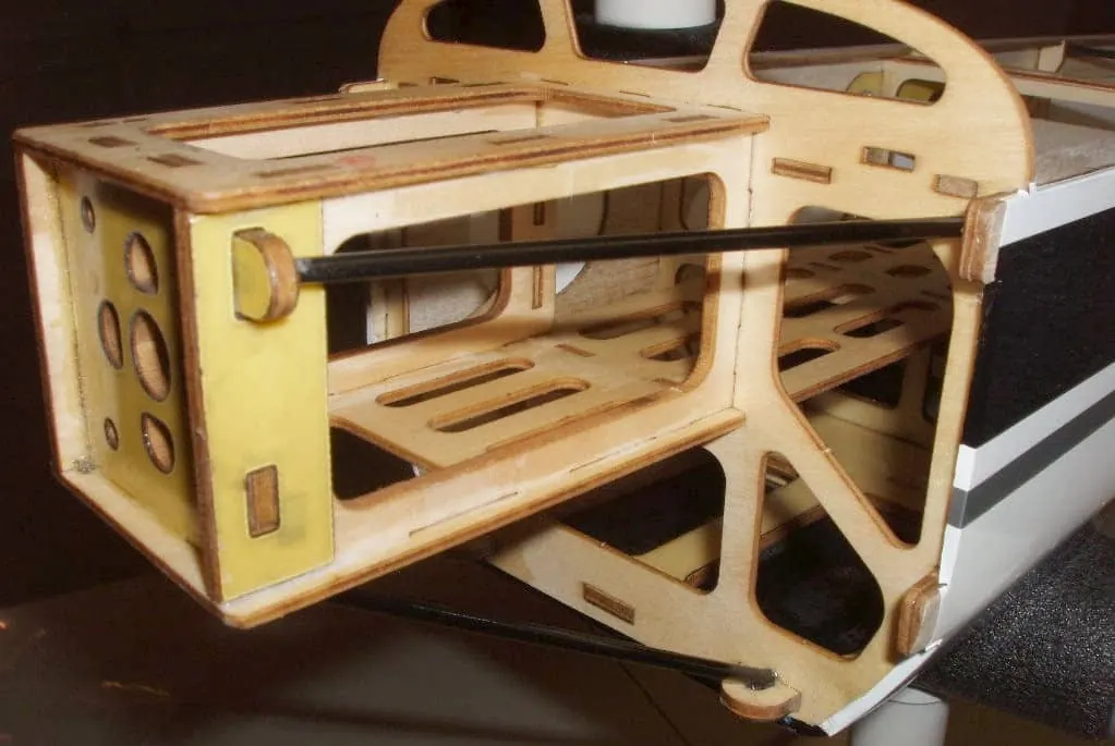 Laser-cut plywood fuselage frame and battery compartment at the nose of an ARF RC plane