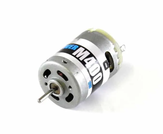 Silver M400 brushed electric motor with its output shaft and solder tabs