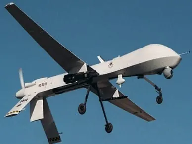 Predator military drone in flight against a blue sky