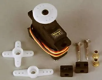 Hitec HS-81 micro servo with its servo horns, mounting screws, rubber grommets and brass eyelets