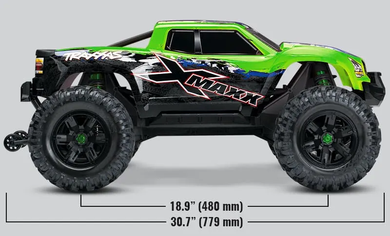 Green Traxxas X-Maxx RC monster truck with oversized tires, seen from the side with its wheelbase and length marked