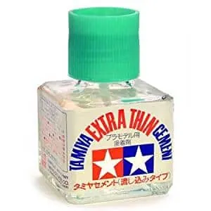 Bottle of Tamiya Extra Thin Cement with a green cap