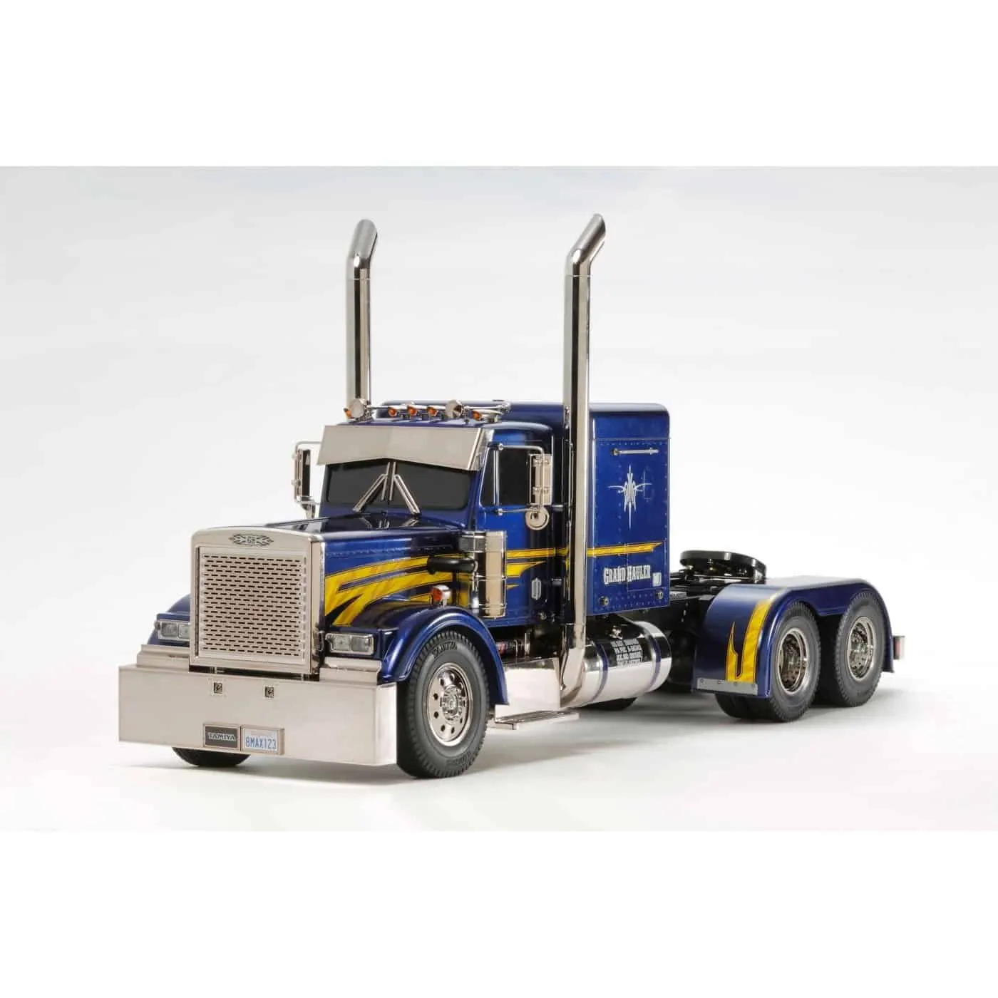Blue American-style RC semi tractor with chrome exhaust stacks, seen from the front
