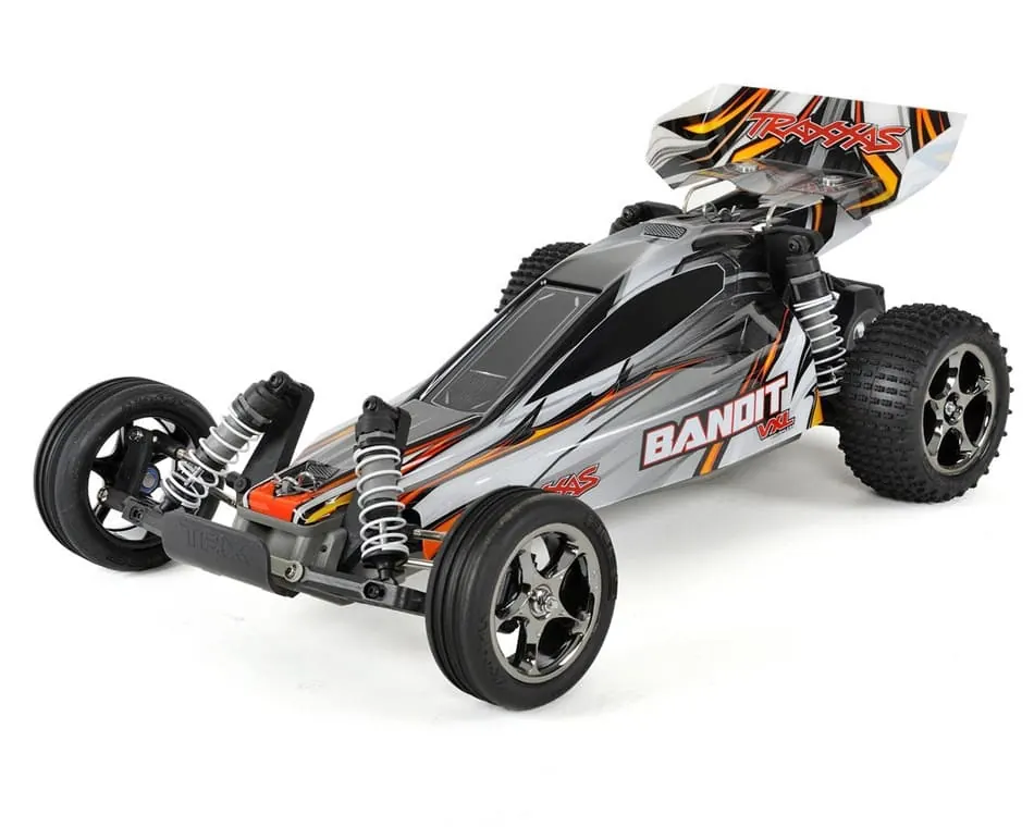 Traxxas Bandit VXL RC buggy with a silver, black and orange body and rear wing