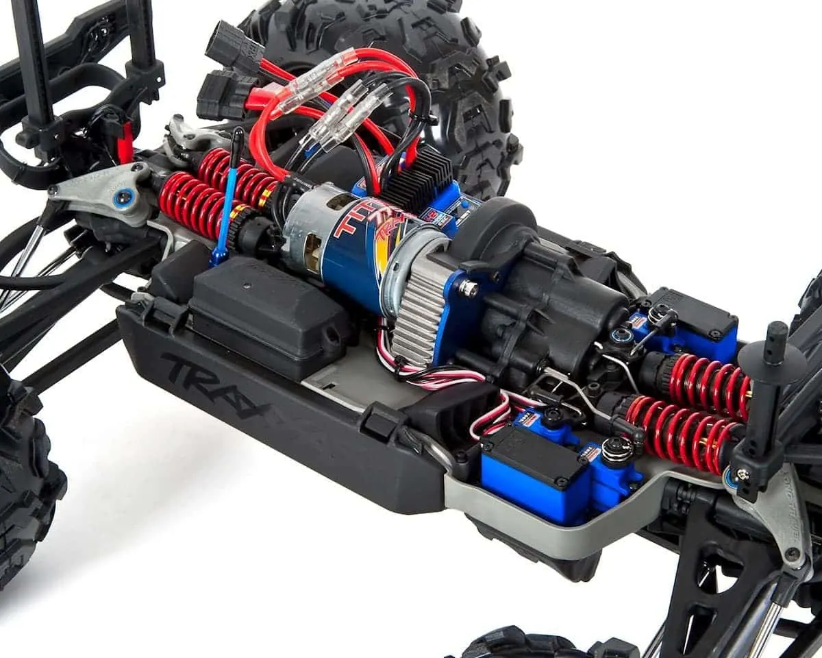 Close-up of the Traxxas Summit chassis with its motor and red shocks