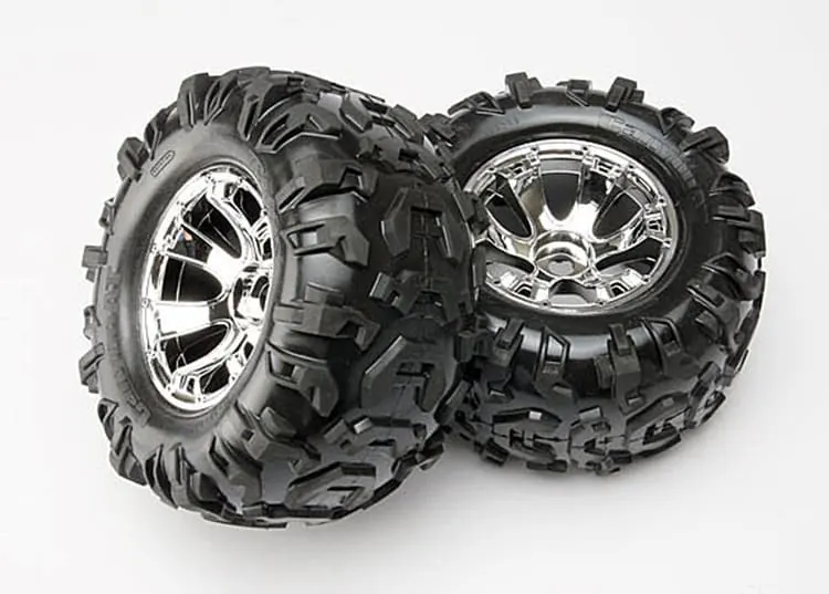 Pair of chrome Traxxas T-Maxx wheels with off-road tires