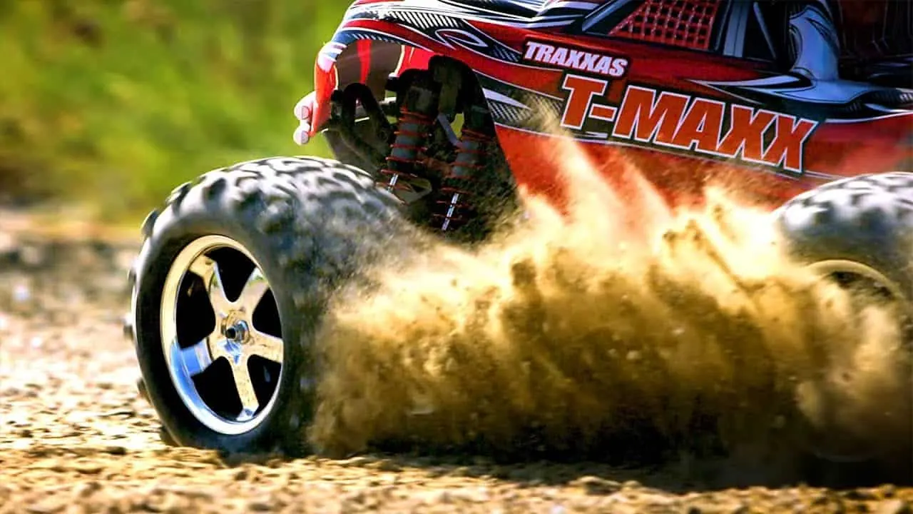 Traxxas T-Maxx kicking up dust on a dirt track