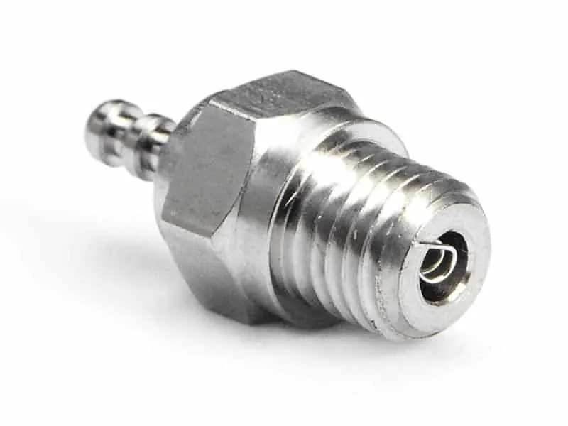 Nitro RC engine glow plug with its threaded body and coiled element visible