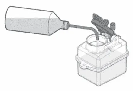 Fuel bottle filling an RC car's fuel tank through its tube