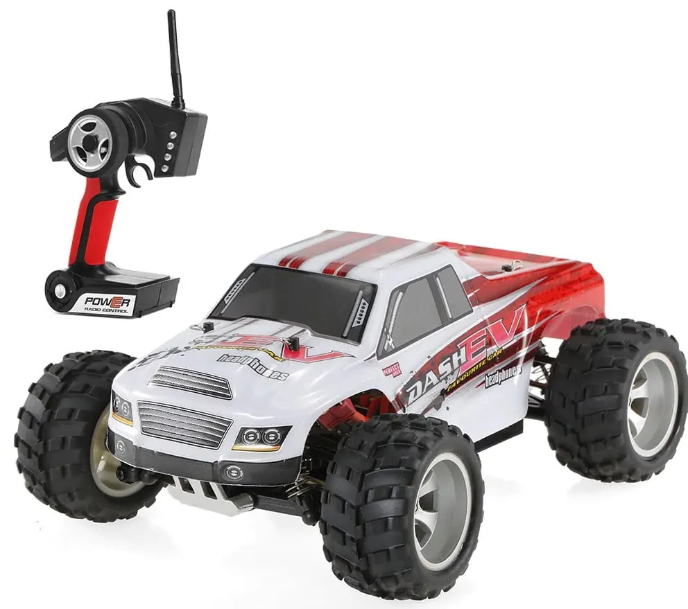 WLtoys A979 RC monster truck with a white and red body next to its transmitter